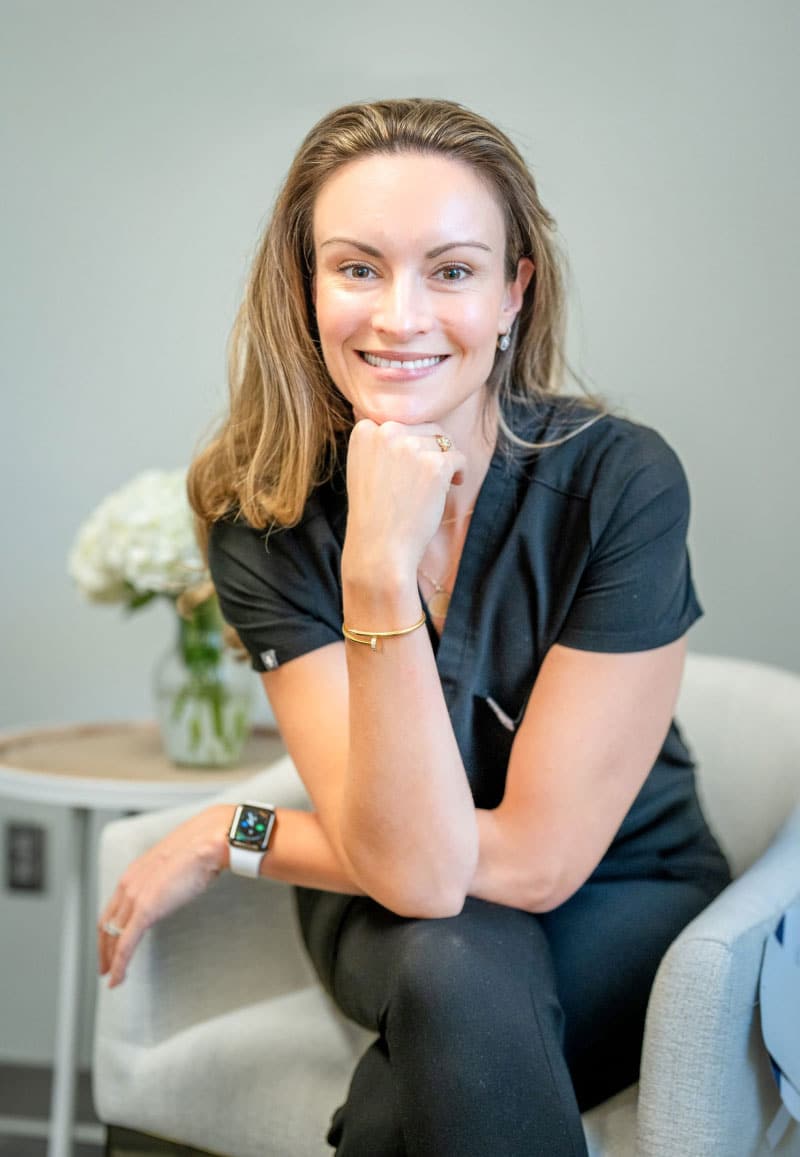 Dr. Langelier Sitting on Chair with Smile Pose