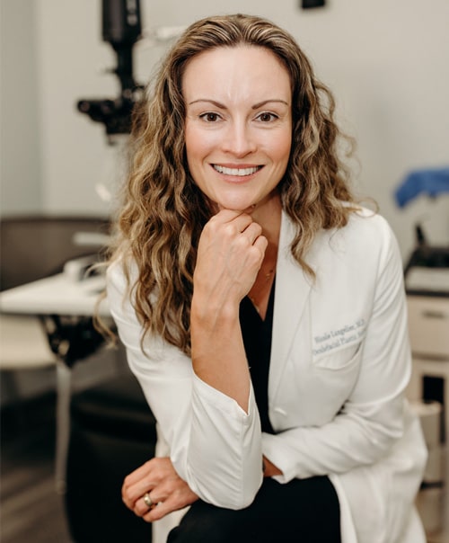 Dr. Langelier Smiling and Posing towards Camera