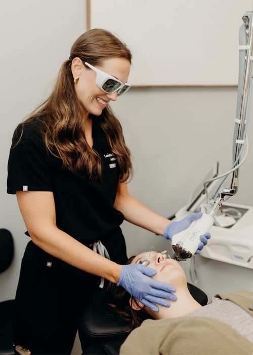 Leisha examining patient on procedure of Sction Halo