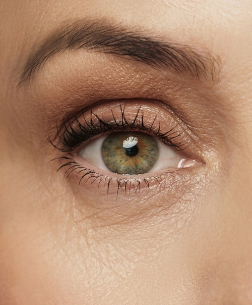 stock image of Close-up of aged female eye with wrinkled skin