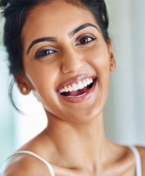 stock image of an attractive young woman going through her morning routine